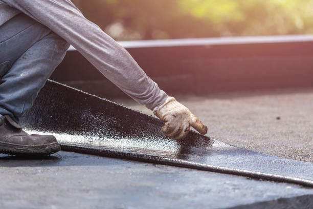 Professional Basement Waterproofing technician working in Towson, MD